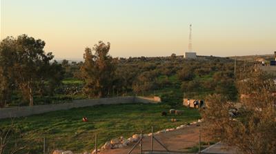 An Israeli camera in the distance overlooks the village of Budrus. [Mersiha Gadzo/Al Jazeera]