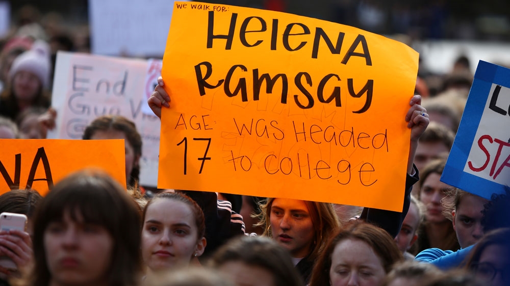 A student holds a sign in memory of Helena Ramsay, a victim of the Parkland, Florida, shooting during the National School Walkout [Lindsey Wasson/Reuters] 