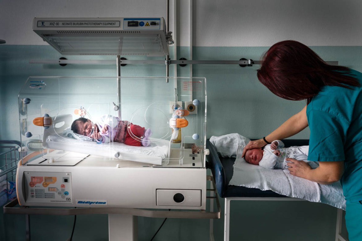a midwife takes care of newborns at the BAR hospital, where the rate of newborn babies is much higher than that of females