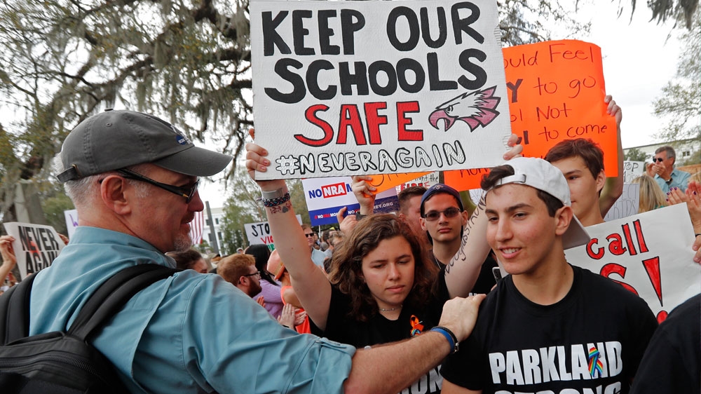 Student survivors from Marjory Stoneman Douglas High School arrive at a rally for gun control reform on the steps of the state capitol, in Tallahassee, Florida [The Associated Press]