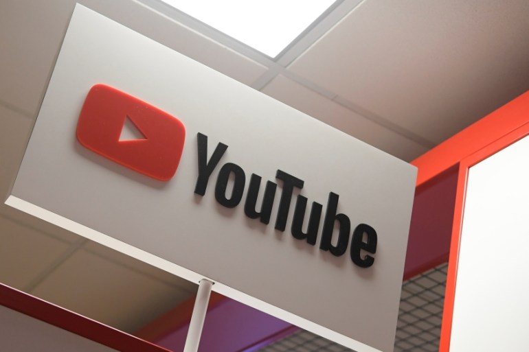 Signage is seen at a YouTube stand at the Labour Party Conference venue in Brighton, Britain