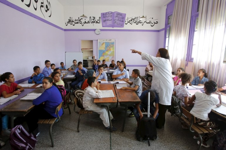 Schoolchildren listen to a teacher as they study during a class in the Oudaya primary school in Rabat, September 15, 2015, at the start of the new school year in Morocco. Nearly three years after Tali
