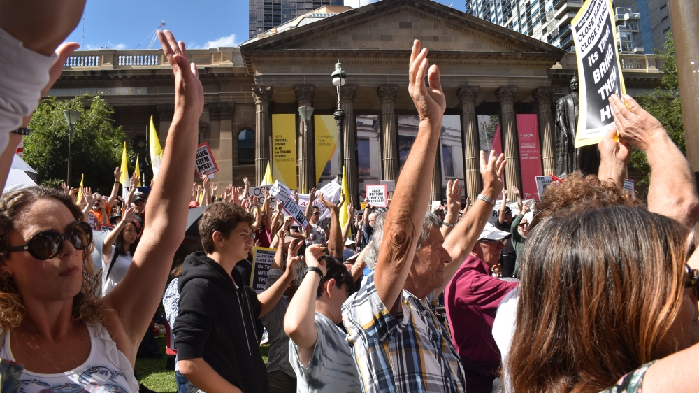 Protesters chanted 'shame' and 'free, free the refugees' at the rally [John Power/Al Jazeera]