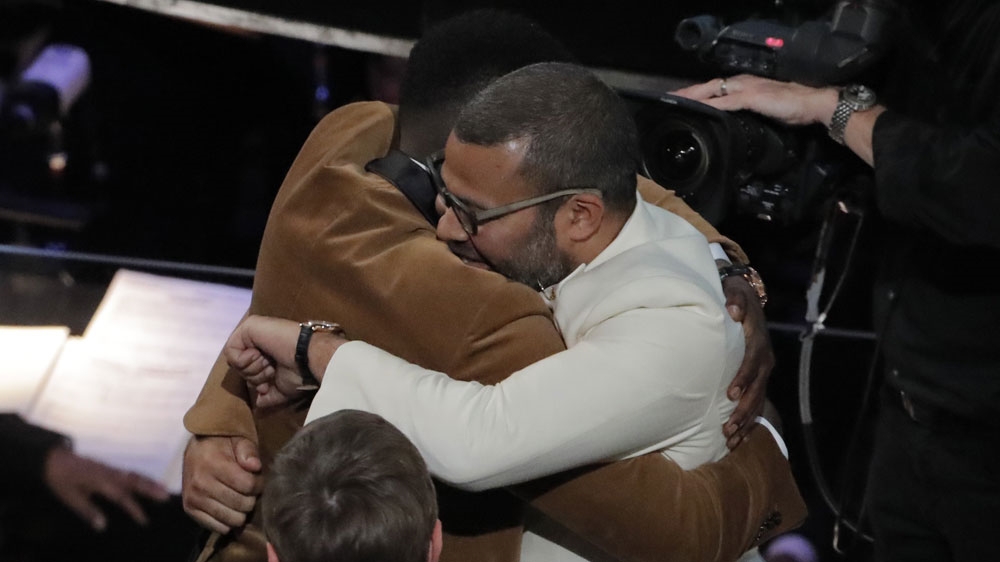 Best Original Screenplay winner Jordan Peele (R) hugged Get Out star Daniel Kaluuya (L) [Lucas Jackson/Reuters]