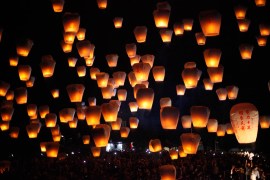 Thousands of flying lanterns hand-written with different people’s wishes are released into the sky in Ping Xi’s Sky Latern Festival. Sky lanterns are scheduled to be released together at eight differe