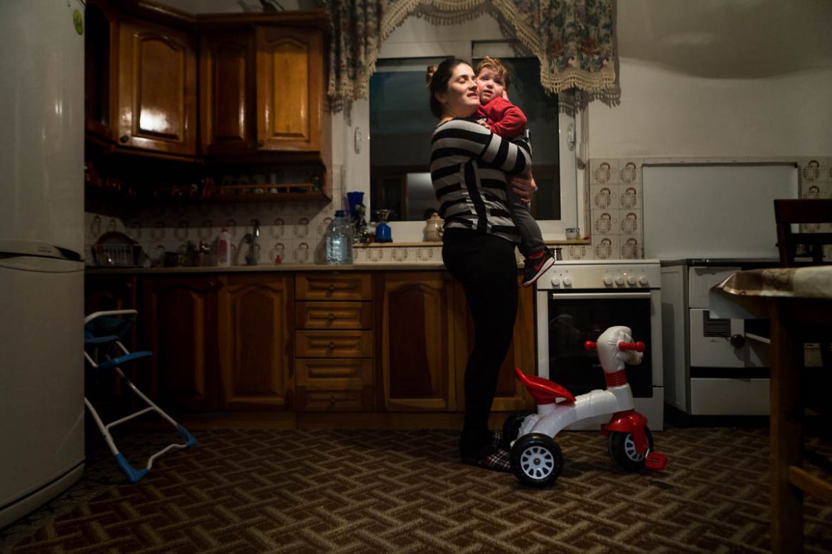 Tijana Lukic, who has two daughters and a son, in her kitchen with the son who made her proud in the eyes of her family.