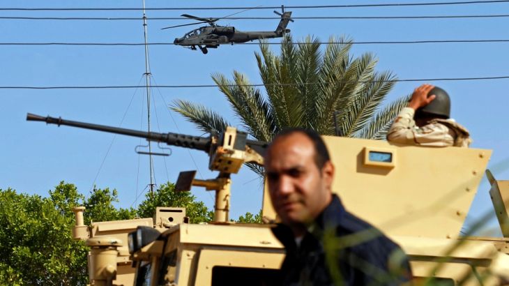 Military forces and helicopters secure an area in North Sinai