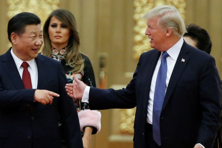 U.S. President Donald Trump and China''s President Xi Jinping arrive at a state dinner at the Great Hall of the People in Beijing
