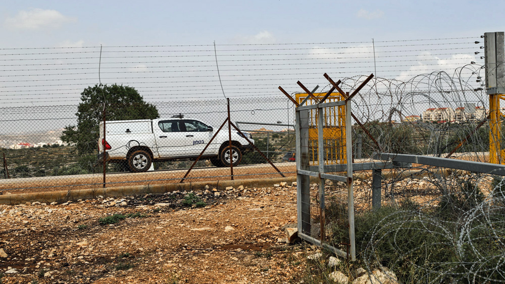 A view of the electric separation fence in Salfit, which Israeli security forces constantly patrol [Jaclynn Ashly/Al Jazeera]