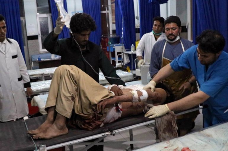 An Afghan man receives treatment at a hospital after a bomb blast in Herat province