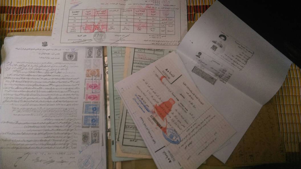 Abu Yahya took his personal documents in case he needs a new life in a different country [Al Jazeera]
