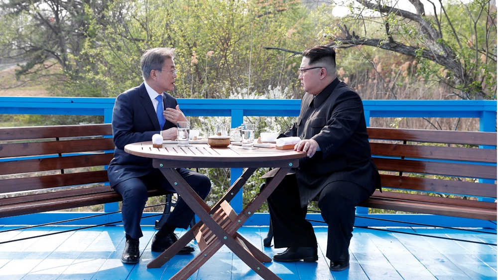 After the tree-planting ceremony, Moon and Kim talked one-on-one [Korea Summit Press Pool via Reuters]