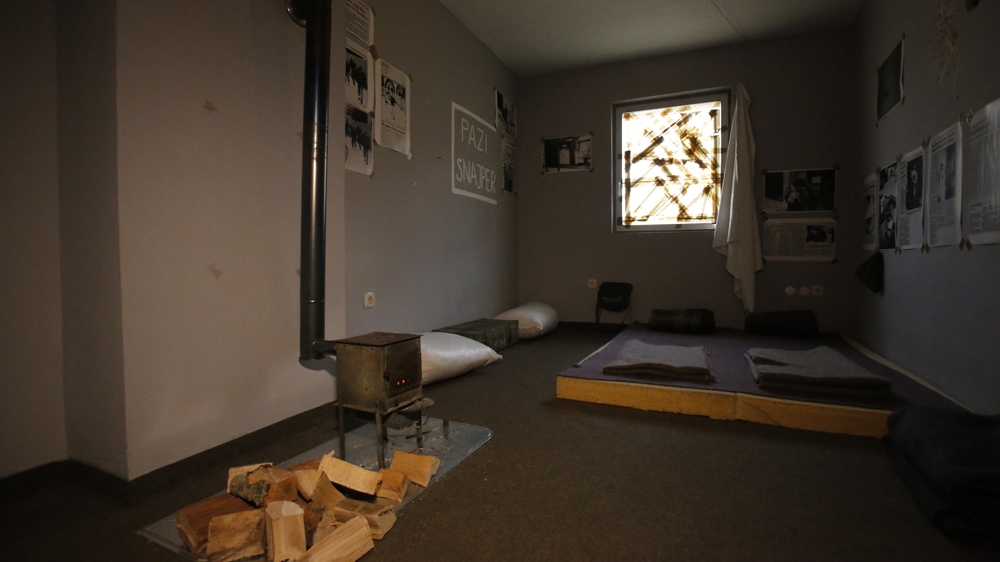 Guests at the War Hostel fall asleep on sponge mats to the sound of gunfire [AP Photo/Amel Emric]