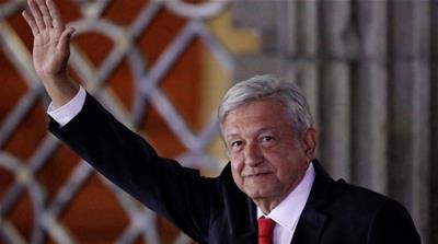 Leftist frontrunner Andres Manuel Lopez Obrador of MORENA gestures while leaving the Palacio de Mineria [File: Reuters]