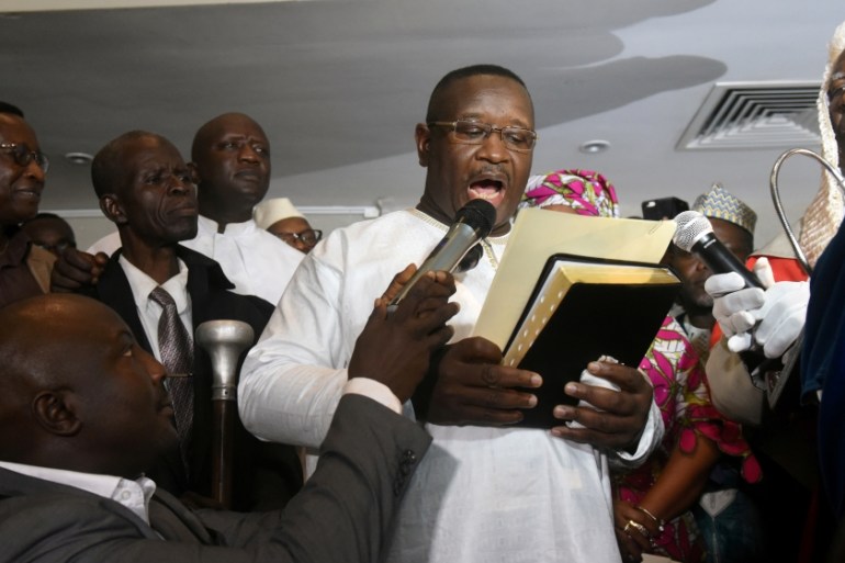 Opposition candidate and former military junta leader Julius Maada Bio takes his oath as Sierra Leone''s new president in Freetown