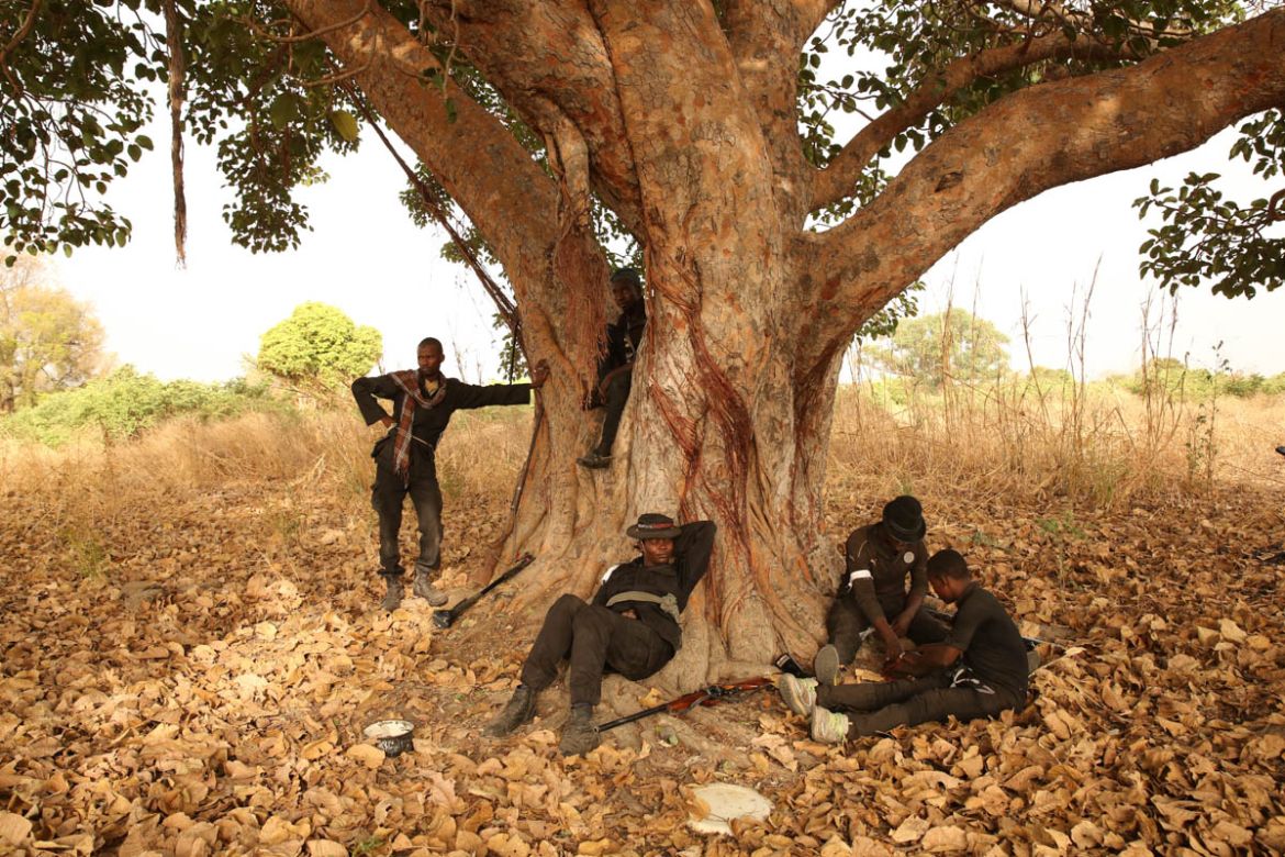 Aisha and hunters under her command take a break from tracking Boko Haram deep inside Sambisa Forest. Copyright: Rosie Collyer