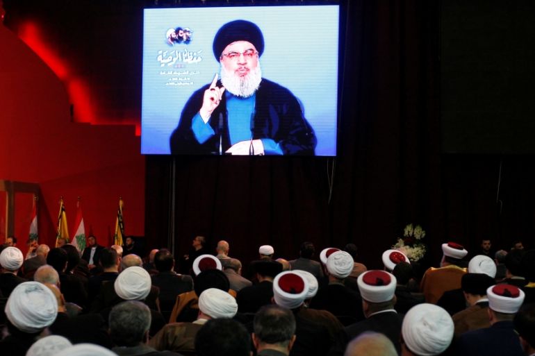 Lebanon''s Hezbollah leader Sayyed Hassan Nasrallah is seen on a video screen as he addresses his supporters in Beirut