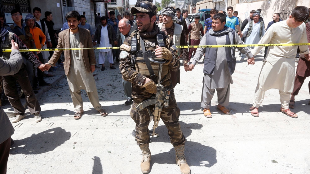 Security forces stood guard at the site of the attack in Kabul's Dasht-e-Barchi [Omar Sobhani/Reuters]
