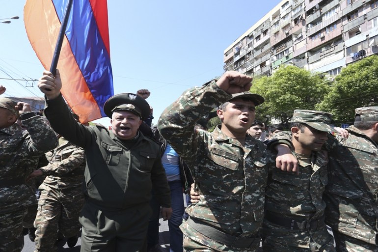 People march during a protest against the appointment of ex-president Serzh Sarksyan as the new prime minister in Yerevan, Armenia April 23, 2018. [Vahram Baghdasaryan/Reuters]