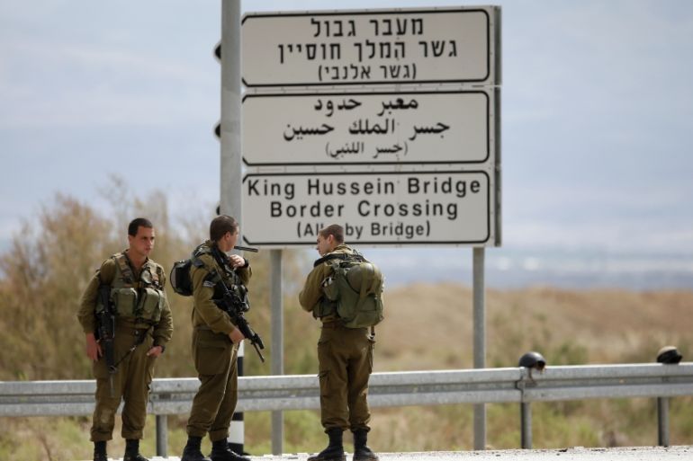 Israeli soldiers stand guard near the entrance to Allenby Bridge, a crossing point between Jordan and the occupied West Bank, near Jericho