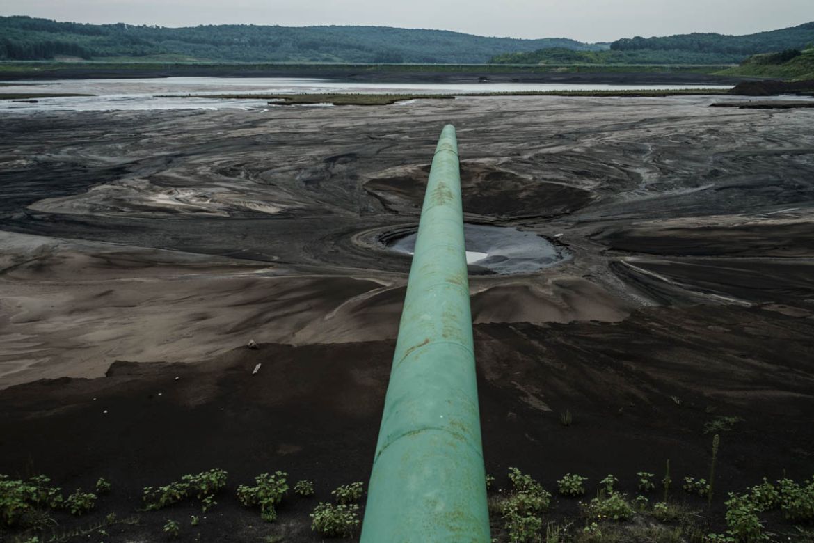 Power plants make an impact on the environment by using land to store vast amounts of coal ash containing heavy metals. When the ash gets airborne, it poses a threat to the health of communities nearb