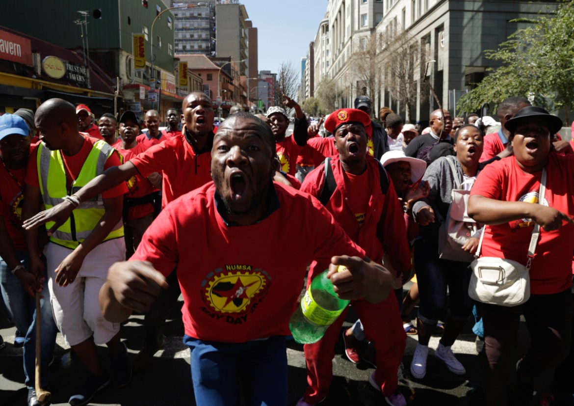 South Africa Federation Of Trade Unions (SAFTU) protesters gather in downtown Johannesburg, Wednesday, April 25, 2018, ahead of a march against the national minimum wage and the proposed changes in th