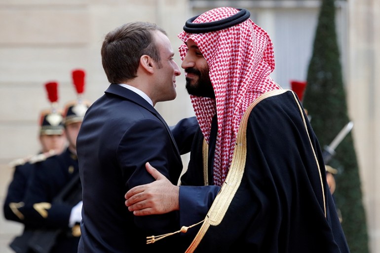 French President Emmanuel Macron embraces Saudi Arabia''s Crown Prince Mohammed bin Salman