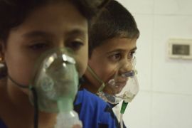 Children, affected by a gas attack, breathe through oxygen masks in the Damascus suburb of Saqba on August 21, 2013 [Reuters/Bassam Khabieh]