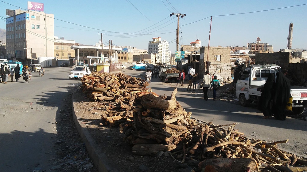 Many Yemenis have resorted to buying firewood amid the chronic shortage of cooking gas [Faroq Moqbel/Al Jazeera]