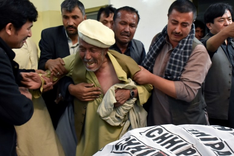 A father of a member of Hazara community, who was killed along with others sone by unidentified gunmen, mourns the death of his son at hospital in Quetta