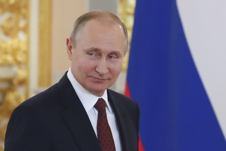 Russian President Vladimir Putin attends a ceremony