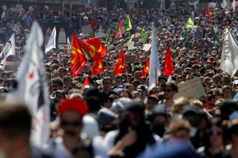 People attend a demonstration against the French government''s reform plans as part of a national day of protest, in Nantes