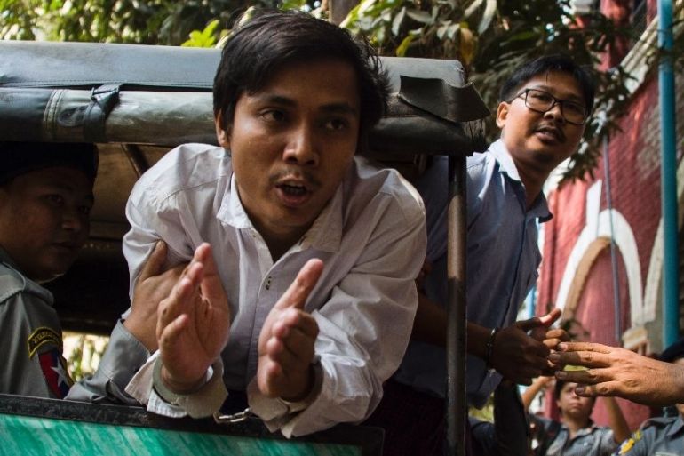 Myanmar journalists Kyaw Soe Oo (C) and Wa Lone (R)