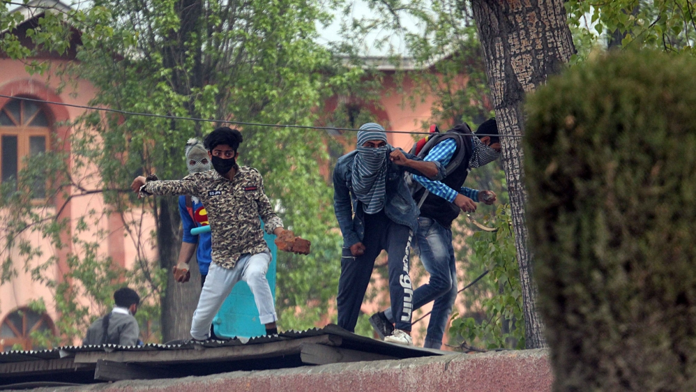 Students threw stones at police and raises anti-India slogans [Faisal Khan/Al Jazeera]