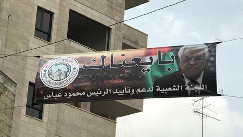 In recent weeks, banners pledging allegiance to Palestinian Authority President Mahmoud Abbas have popped up across the West Bank [Yumna Patel/Al Jazeera]