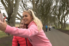 Tourists at the Dark Hedges in Ireland