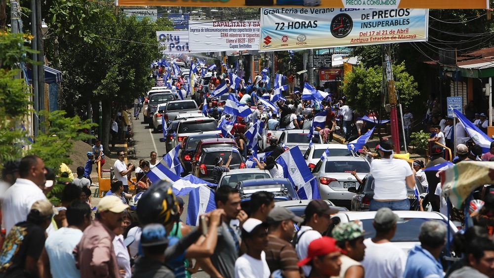 Anti-government protesters arrive by caravan from the capital to show solidarity with the town of Masaya, Nicaragua [Alfredo Zuniga/AP]