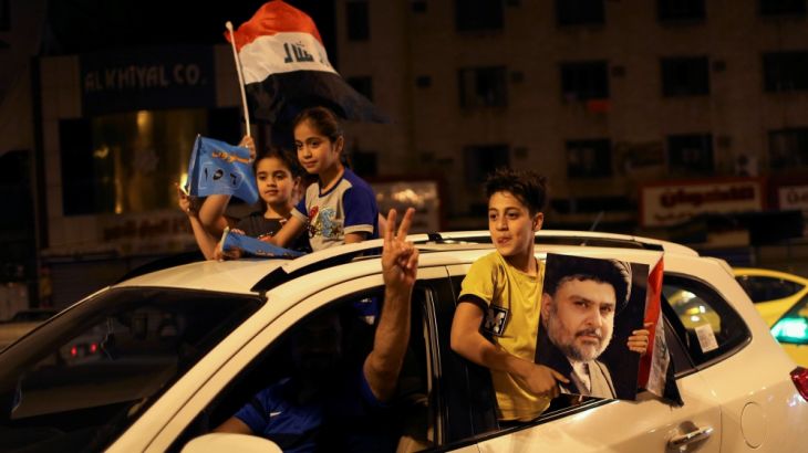 Iraqi supporters of Sairun list celebrate with Iraqi flags and a portrait of Shi''ite cleric Moqtada al-Sadr after results of Iraq''s parliamentary election were announced in Baghdad