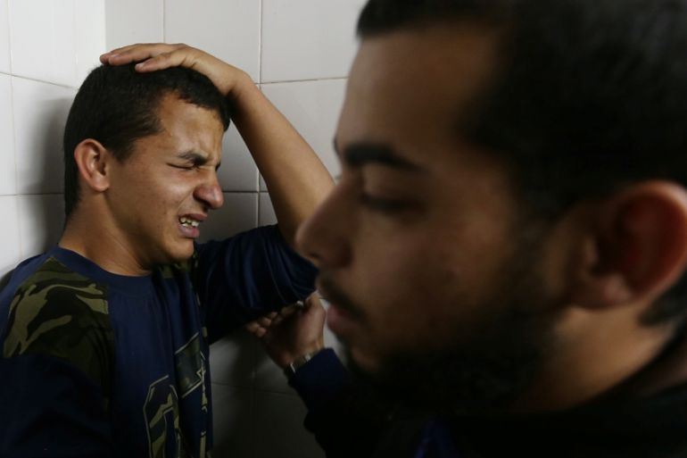 A relative of a Palestinian who was killed at the Israel-Gaza border reacts at a hospital, in the southern Gaza Strip May 6, 2018. [Ibraheem Abu Mustafa/Reuters]