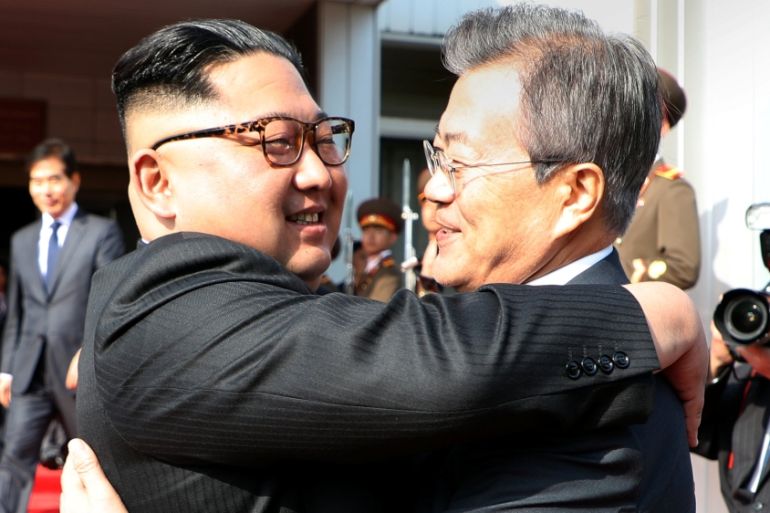 South Korean President Moon Jae-in bids fairwell to North Korean leader Kim Jong Un as he leaves after their summit at the truce village of Panmunjom