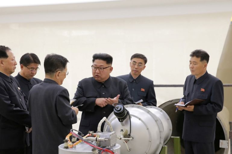 North Korean leader Kim Jong Un provides guidance with Ri Hong Sop (3rd L) and Hong Sung Mu (L) on a nuclear weapons program in this undated photo released by North Korea''s Korean Central News Agency
