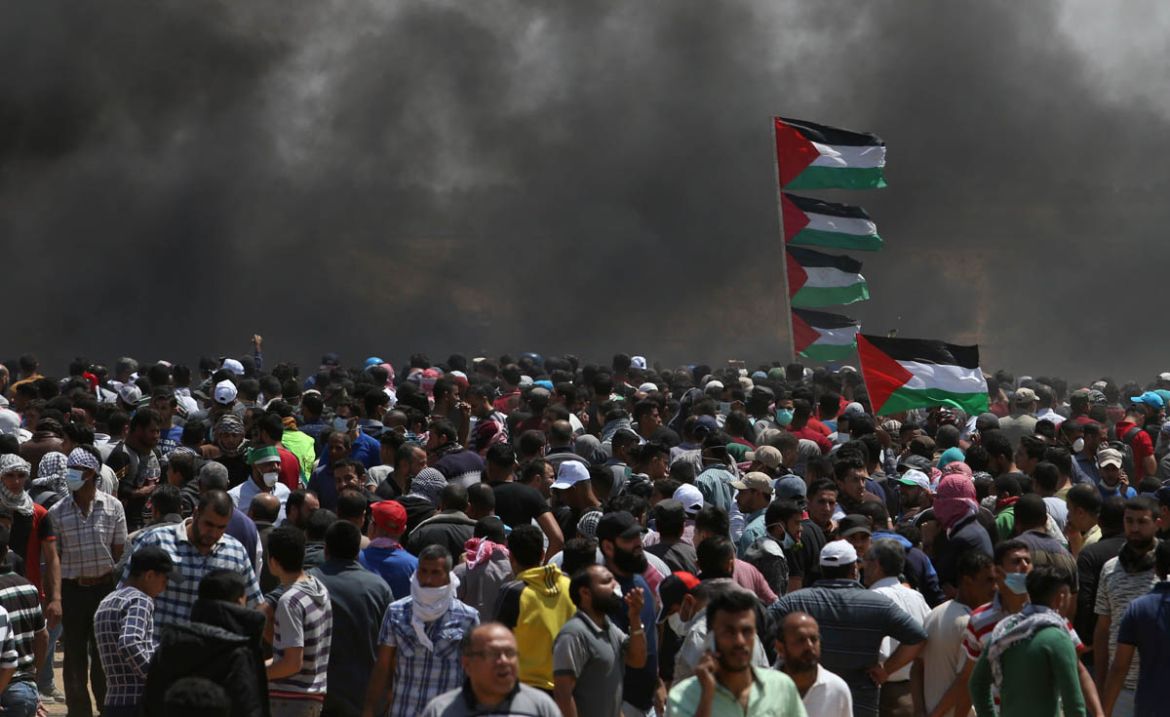 Palestinian demonstrators gather during a protest against U.S. embassy move to Jerusalem and ahead of the 70th anniversary of Nakba, at the Israel-Gaza border in the southern Gaza Strip May 14, 2018.