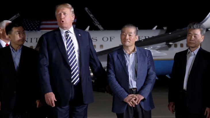 U.S.President Donald Trump speaks to the media next to the Americans released from detention in North Korea, Tony Kim, Kim Hak-song and Kim Dong-chul, upon their arrival at Joint Base Andrews