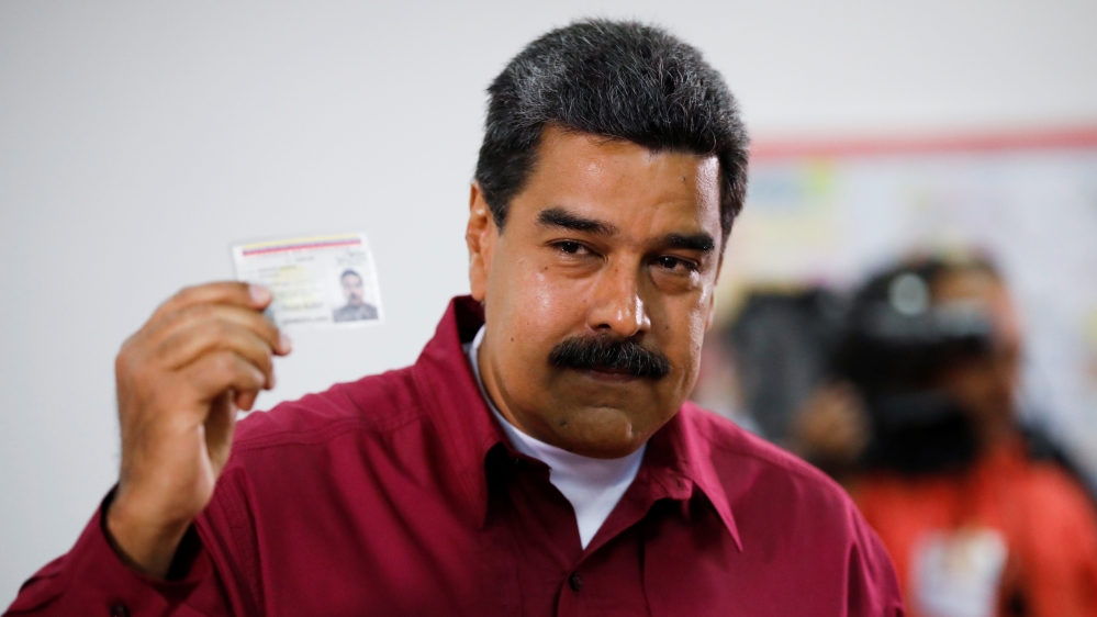 Maduro cast his vote in Caracas early on Sunday [Carlos Garcia Rawlins/Reuters] 