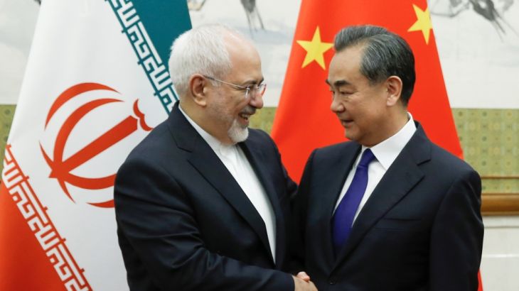 Chinese State Councillor and Foreign Minister Wang Yi meets Iranian Foreign Minister Mohammad Javad Zarif at Diaoyutai state guesthouse in Beijing, China May 13, 2018. [Thomas Peter/Reuters]