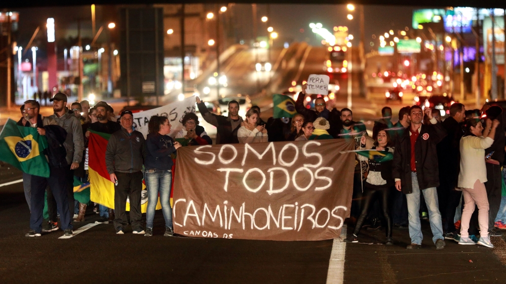 People attend a protest in support of the truck drivers' strike in Canoas [Diego Vara/Reuters]