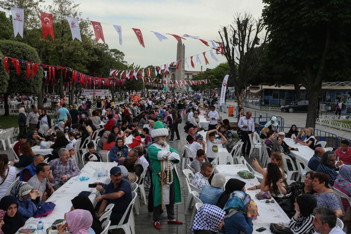 People break their fast in the historic Sultanahmet district of Istanbul, Wednesday, May 16, 2018 on the first day of the fasting month of Ramadan. Muslims throughout the world are marking Ramadan - a