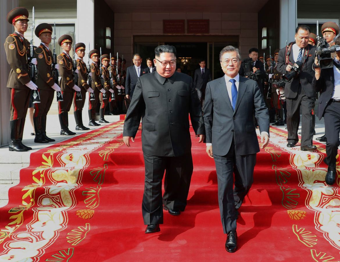 North Korean leader Kim Jong Un, center left, and South Korean President Moon Jae-in, right, walk after their meeting at the northern side of Panmunjom in North Korea. Moon said Sunday, May 27, that