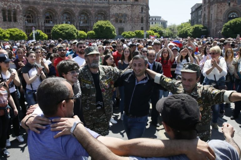 Armenian opposition supporters dance on the street after protest movement leader Nikol Pashinyan announced a nationwide campaign of civil disobedience in Yerevan