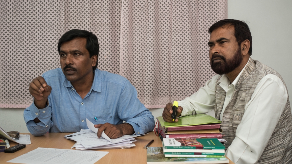 Activist Khandakar, left, says officials at district level are flouting court order [Al Jazeera]